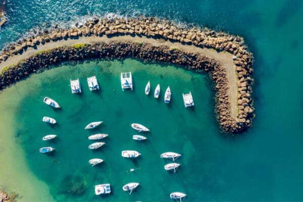 Aerial view of luxury boats in an ocean bay